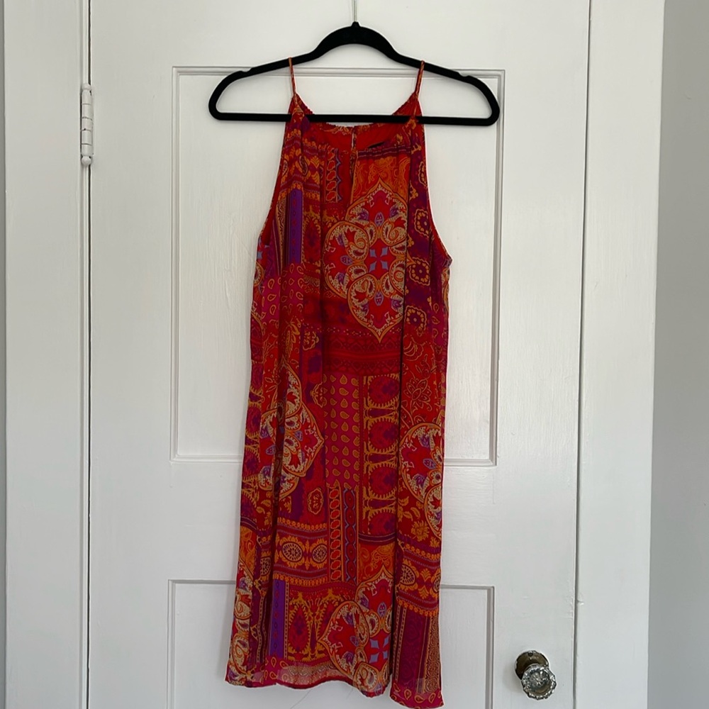 Adorable halter top mini red dress with patchwork print.